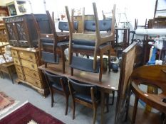 Vanson, A 1970's long sideboard having sliding doors, a matching drawer leaf dining table and a set