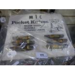 A advertising display for MIC pocket knives including 6 examples on card from USA