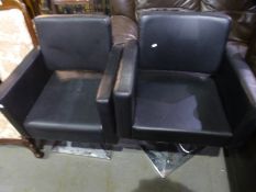 A pair of Barber chairs having square chrome base
