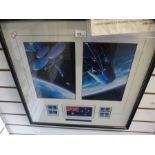 A framed display relating to the space shuttle discovery and an official Aussat flag which was aboar