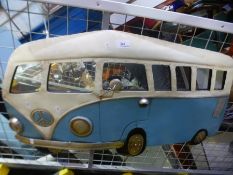 A metal wall hanging of vintage VW campervan