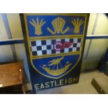 Large wooden sign advertising Eastleigh
