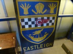 Large wooden sign advertising Eastleigh