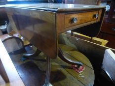 An antique mahogany two flap Pembroke table on center pillar and quadruped supports