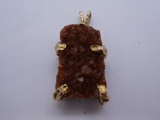 A modern gemstone pendant made from large rectangular possibly Orange River Quartz segment, with 9ct