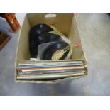 A carton of old Lp's and singles mainly 1970's