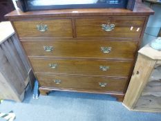 An antique mahogany chest having two short and three long drawers on bracket feet