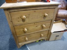 A stripped pine chest having three drawers