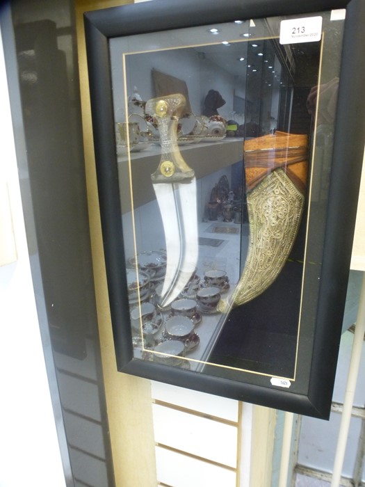 A Far Eastern style dagger and sheath, in glazed display case