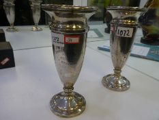 A pair of silver vases with engraved wording hallmarked Birmingham 1926, 1927 possibly Sandes and Ma