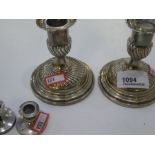 A pair of Victorian silver candlesticks with half reeded design, hallmarked London 1888 Horace Woodw