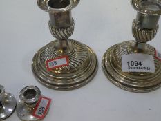 A pair of Victorian silver candlesticks with half reeded design, hallmarked London 1888 Horace Woodw