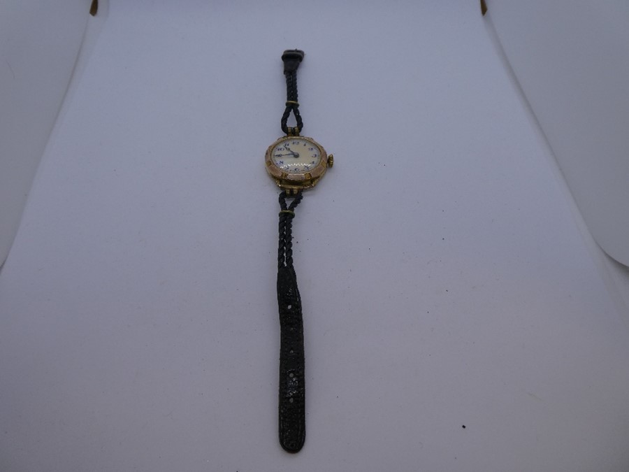 Vintage ladies gold plated wristwatch with pearlescent dial on black leather strap - cannot open bac