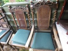 Four dining chairs with green seats and carved backs