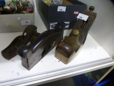 Three woodworking planes one with a stamp saying Morris 50 London