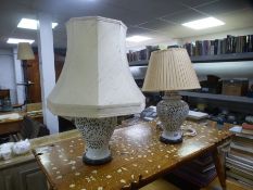 A pair of china table lamps having pierced decoration and five coloured prints of military soldiers