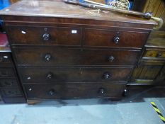 An antique mahogany chest having two short and three long drawers