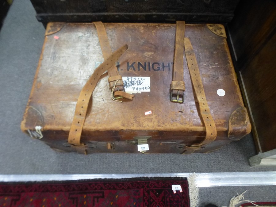 An antique leather travelling case having removeable tray, and side handles, 77cms