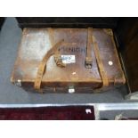 An antique leather travelling case having removeable tray, and side handles, 77cms