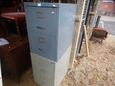 Two small fishing cabinets and a formica table