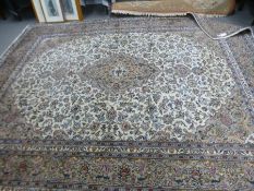 A large Persian style carpet having allover floral decoration, 373cm x 291cm