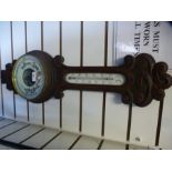 A Victorian carved oak banjo barometer