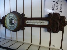 A Victorian carved oak banjo barometer