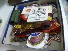 A quantity of cloth badges, vintage Dinky Military vehicles etc