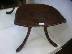 An antique Oak Thebes stool, bearing Liberty and Co label to underside, 45cms