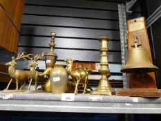 A ships bell and assorted brassware