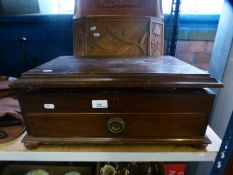 A mahogany cased canteen of silver plated cutlery and a carved oak hanging wall cupboard