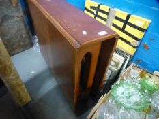 An Oak cupboard having linen fold doors and two flap table