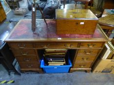 An early 20th century mahogany twin pedestal desk