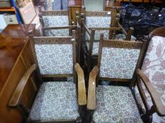 A set of 6 oak dining chairs with floral fabric inserts to include two carvers