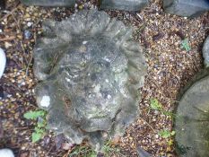 A lion mask wall plaque, three pedestals and an urn