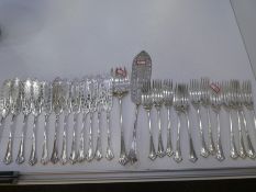 A Victorian silver cutlery set comprising of twelve forks, twelve fish knives, one large serving for