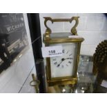 An Old brass carriage clock