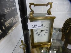 An Old brass carriage clock