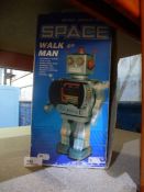 A vintage tinplate space walk man robot
