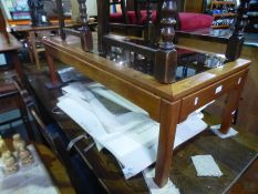 A retro oblong coffee table having tiled and a glass top