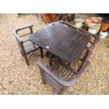 A Teak square garden table and four corner chairs made by Hughes Bolckow taken from the ship SS Rein