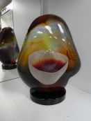 Dino Rosini; a Murano glass sculpture 'Pebble on Base' in calcedonia glass, 32.5cm, with certificate