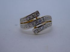 18ct two tone gold crossover ring, set with 23 diamonds, size P, weight approx 4.6g, marked 750