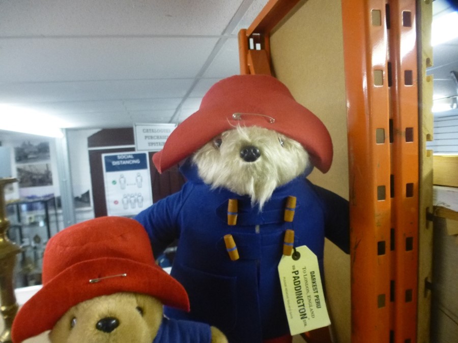 A large Paddington Bear teddy and a similar smaller example