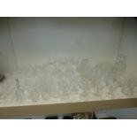 A large quantity of drinking glasses and other crystal some by Stuart