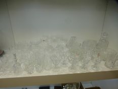 A large quantity of drinking glasses and other crystal some by Stuart