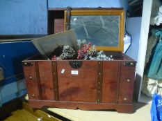 A modern toybox, Christmas decorations, mirror and print