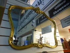 A modern gilt wall mirror