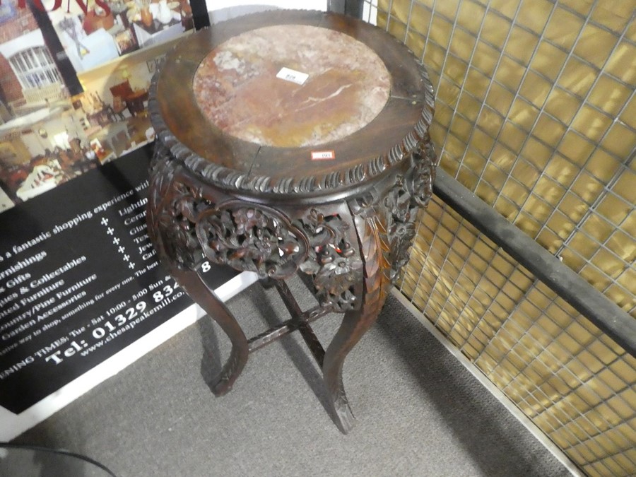 A Chinese carved hardwood jardiniere stand with pierced decoration and rouge marble top, 92 cms high - Image 2 of 3