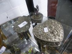 A bronzed tray decorated leaves and flowers and two heart shaped trinket boxes